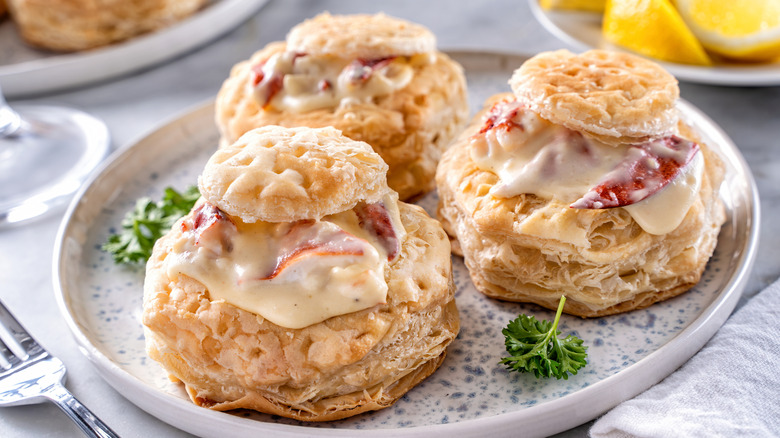 Three lobster Newbergs in puff pastry.
