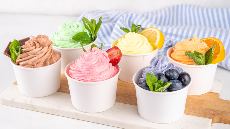 Assortment of frozen yogurts in white cups